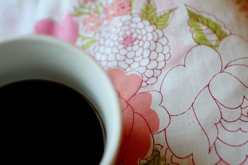 coffee cup on flower apron