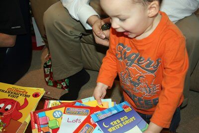 My sweet Caden, surprised and thrilled by "too many Clifford" books on Christmas morning.