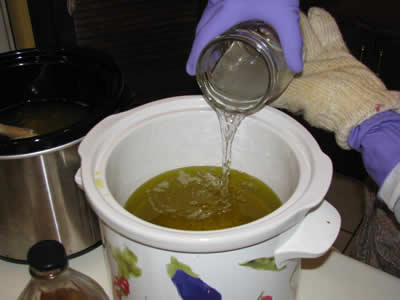 Pouring the lye into the oil