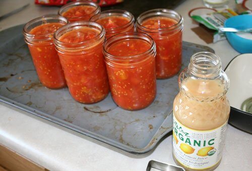 canning tomatoes jars on tray