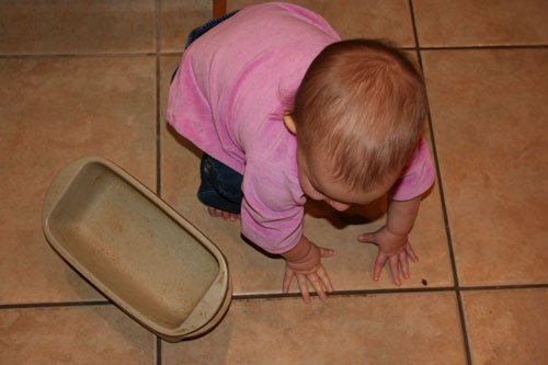 johanna on floor with stoneware breadpans