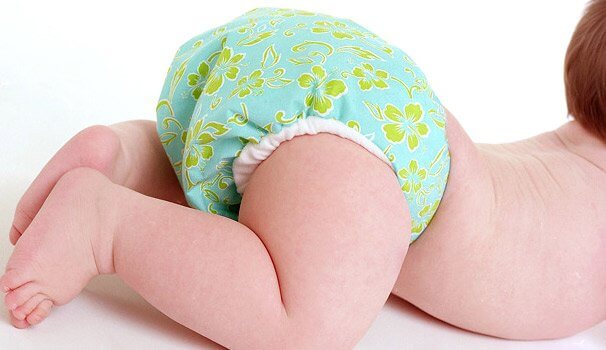 baby with cute cloth diaper on bum
