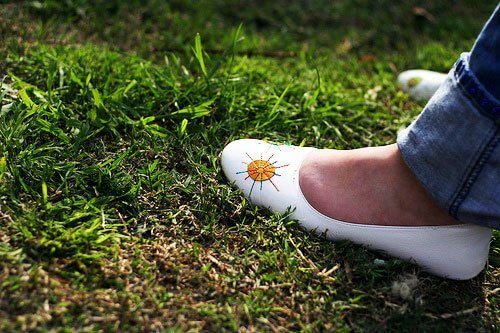 womans shoe on grass