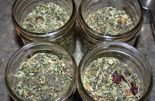 four jars of dry herbs tincture