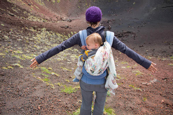 steph leaning over volcano crater at mount etna