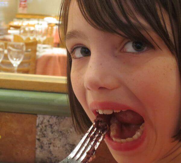 abbie eats blood sausage on a fork