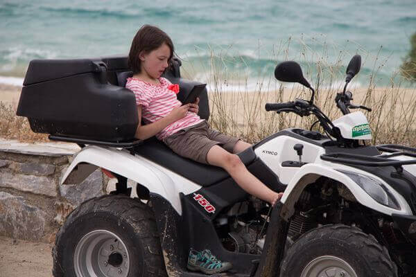 abbie reading on 4 wheeler