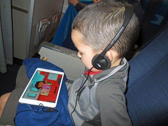 caden watching dora on airplane