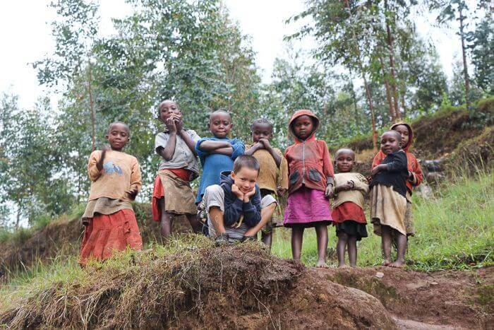 caden with group of kids near rosines house