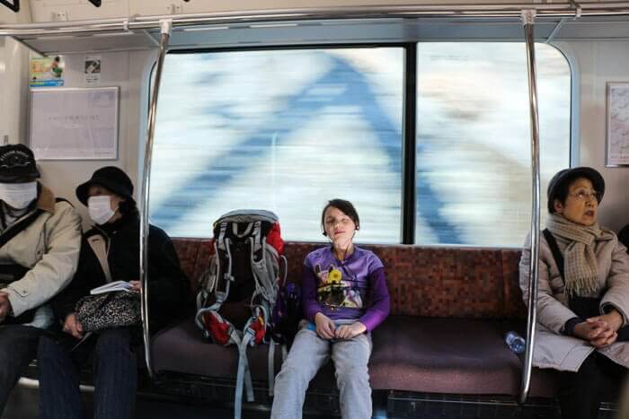 An adorable example of how our family tends to march to the beat of our own drummer... Abigail rocks out to her iPod in a Japanese commuter train. 