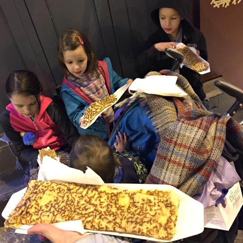 Our kids eating crepes in France.