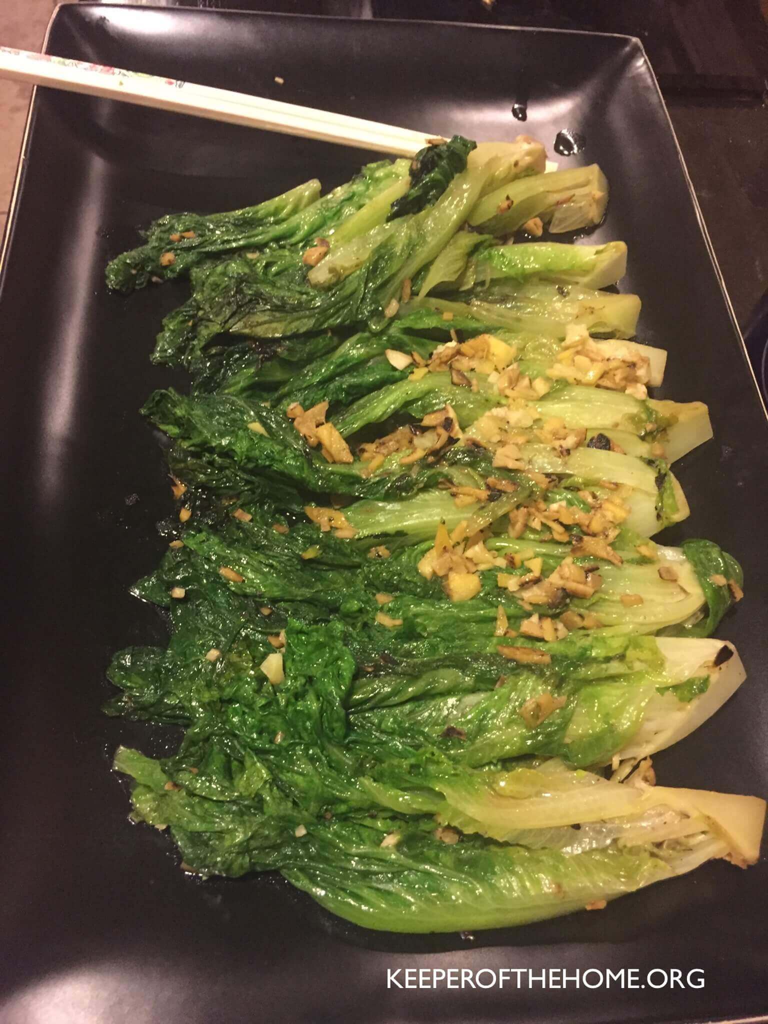 After testing it out for myself, EVERYONE should know how to stir-fry lettuce! Not only is it easy-peasy, but it's delicious (even the kids devoured it!).