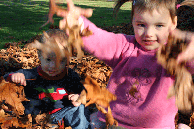 Kids-throwing-leaves-closeup