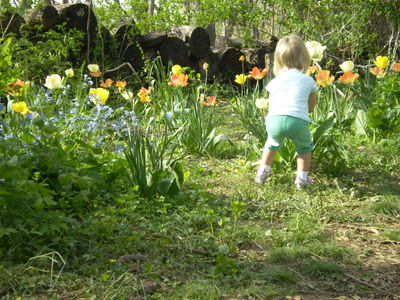 Faiths daughter abigail smells flower