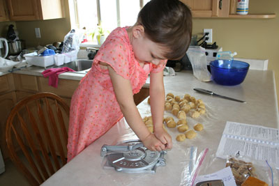 Abbie-flattens-tortillas-with-press