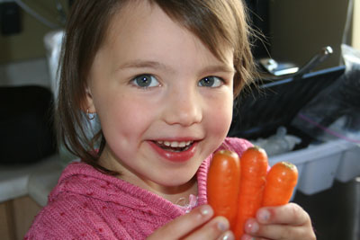 Abbie-holding-garden-carrots